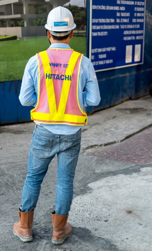 man-standing-near-blue-wooden-sign.jpg man standing near blue wooden sign