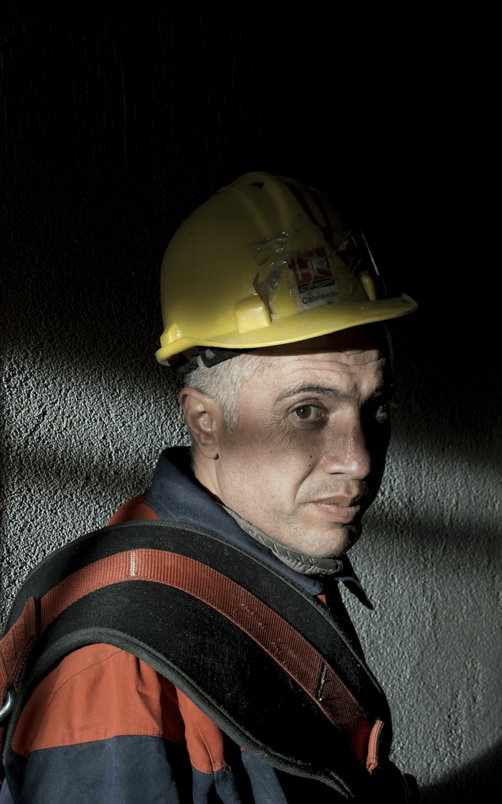 man-in-yellow-hard-hat-and-black-and-red-jacket.jpg man in yellow hard hat and black and red jacket